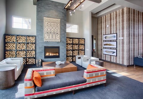 a living room with a couch and a fireplace