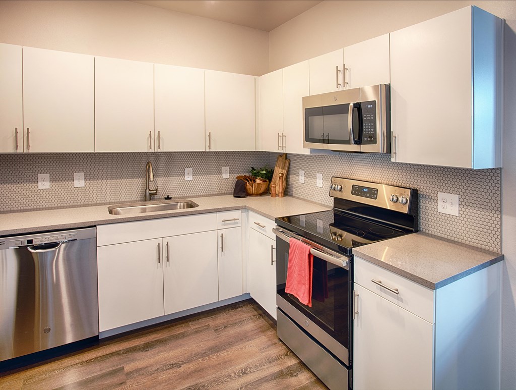 Kitchen with Appliances and White Cabinets