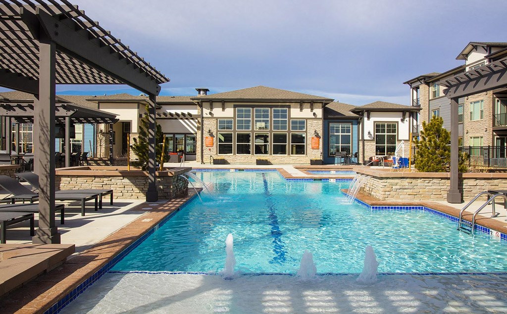 Outdoor Swimming Pool with Splash Jets and Pergolas