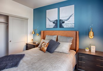 Bedroom with Bed, Nightstands and Blue Accent Wall - Photo Gallery 9