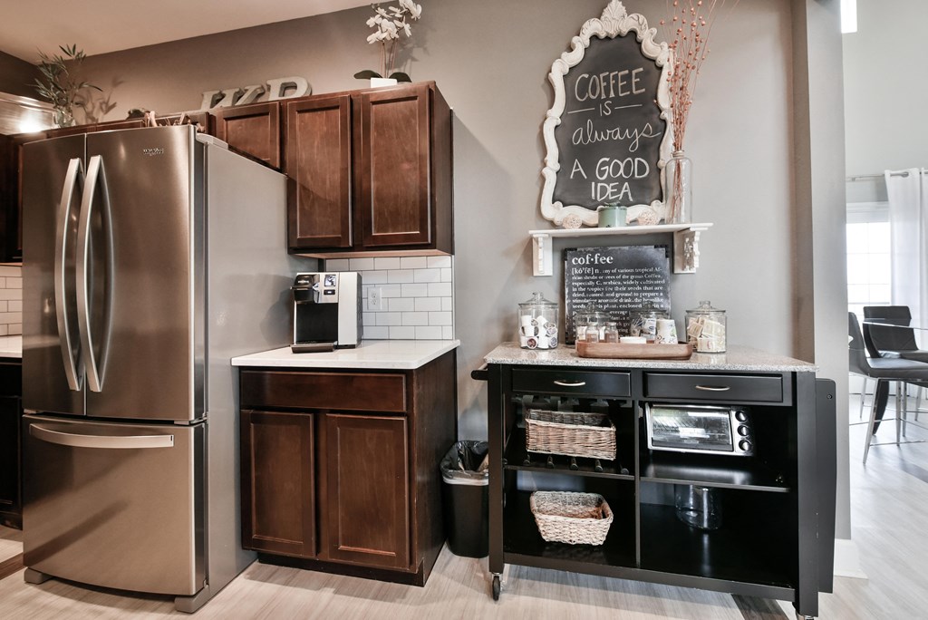 Coffee Bar on Cabinets next to Fridge