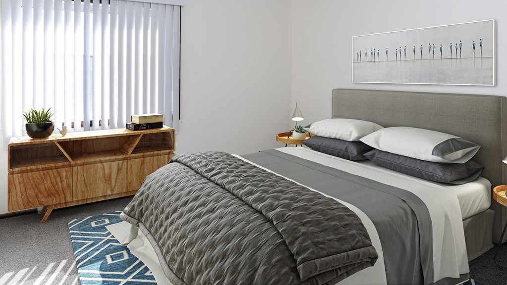 a bedroom with a bed and a dresser and a window