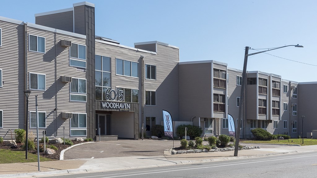 a building with a sign on the side of a street