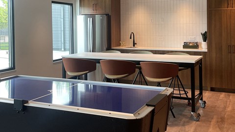a ping pong table in the kitchen of a home