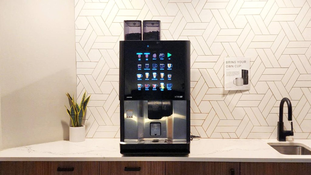 a coffee machine sitting on top of a kitchen counter