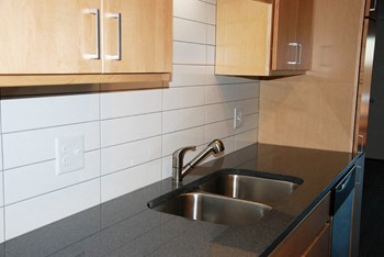 Kitchen with tile backsplash and granite countertops - Photo Gallery 3