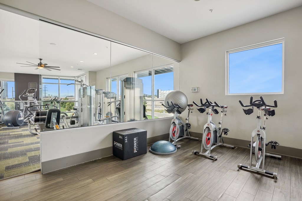A spacious home gym with a variety of exercise equipment.