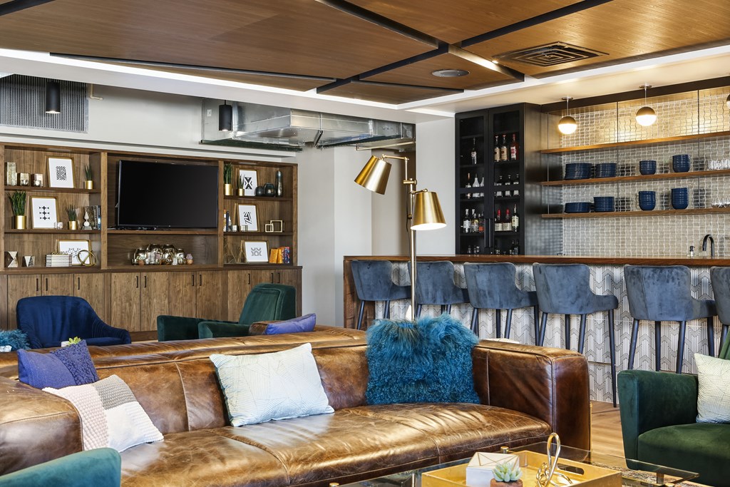 a living room with couches and chairs and a television