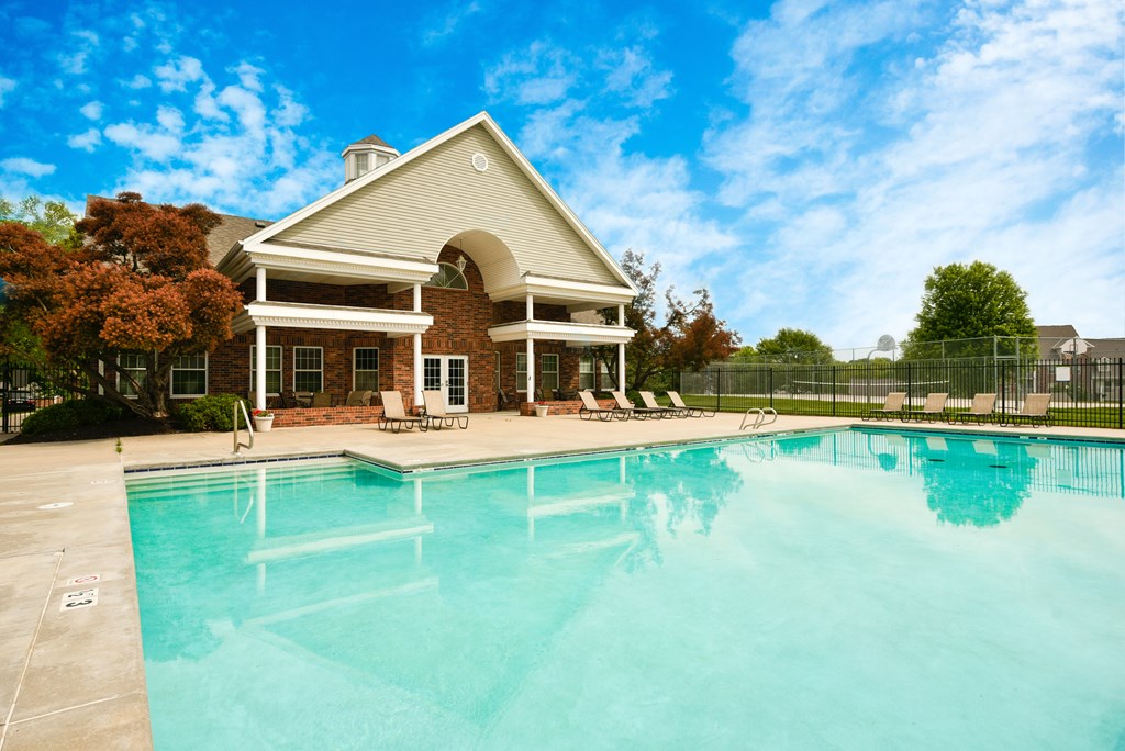 A house with a pool in front of it at The Donovan Apartment Homes, Nebraska