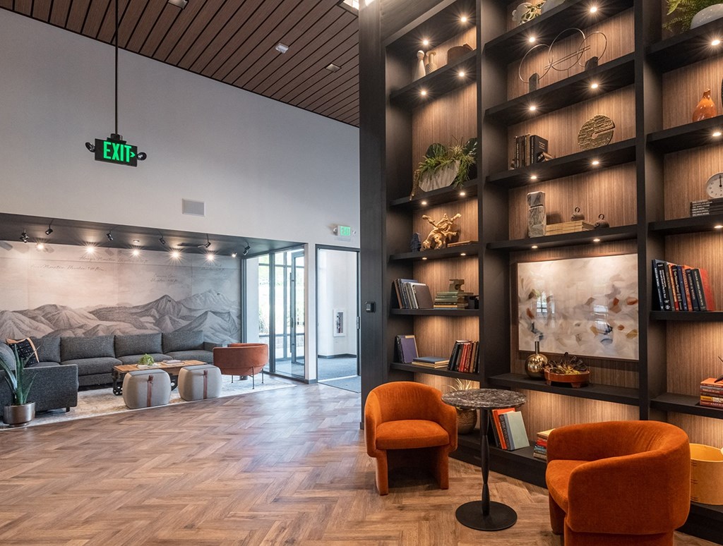 a view of the lobby with a large bookshelf in the background