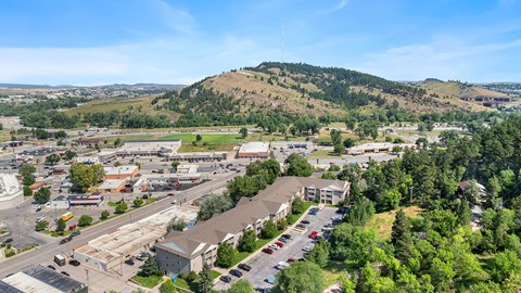 an aerial view of a city with a mountain in the background