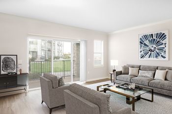 a living room with a couch and two chairs