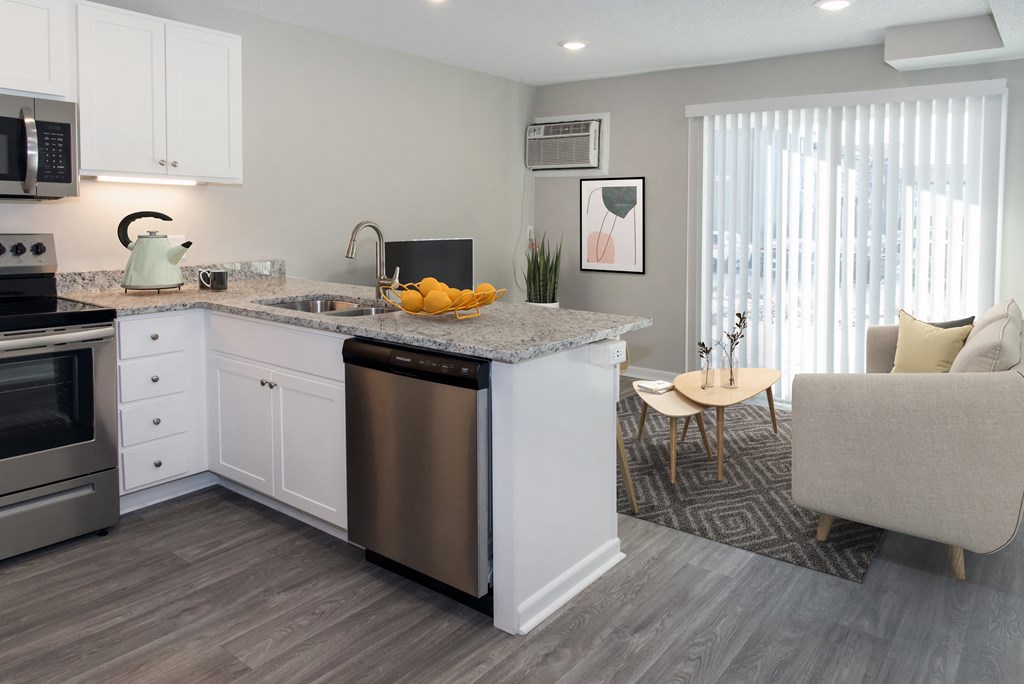 A modern kitchen with a dining area.