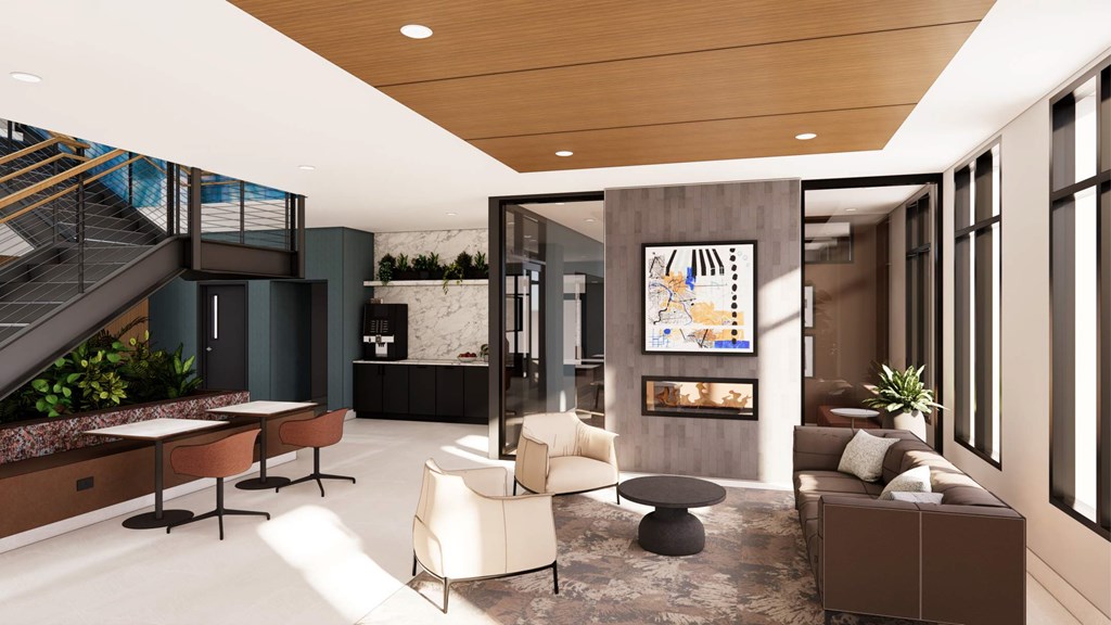 A modern living room with a staircase and a large painting on the wall.