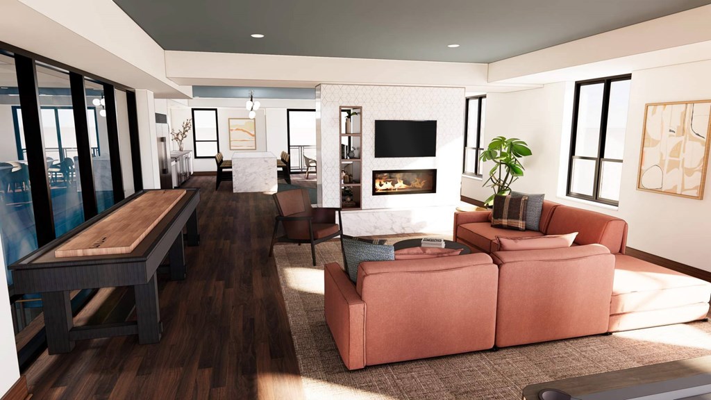 A modern living room with a fireplace and a large sectional sofa.