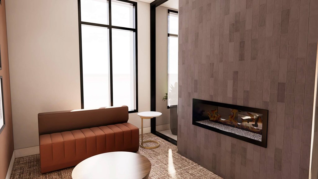 A modern living room with a fireplace and a brown sofa.