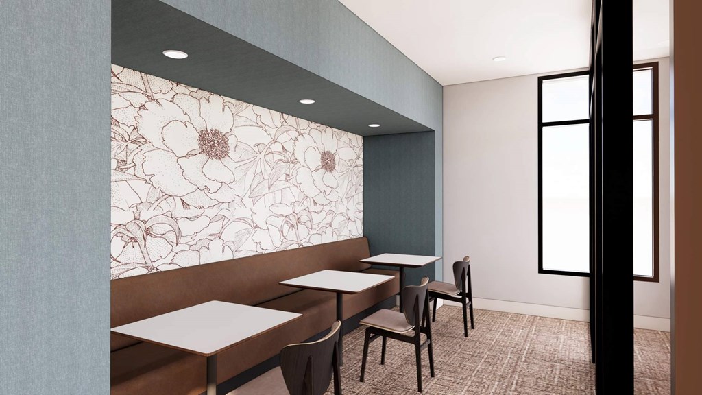 A dining area with a table and chairs.