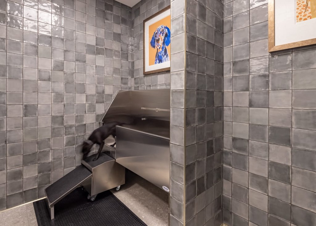 a man is running on a treadmill in a gym