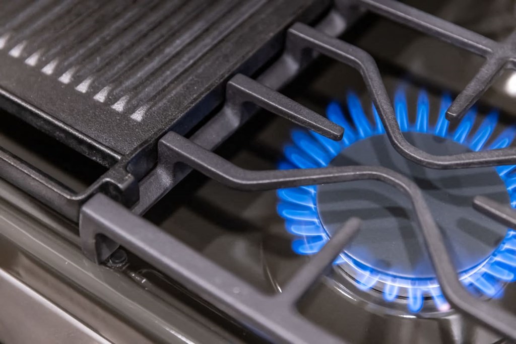 a blue flame on a gas stove
