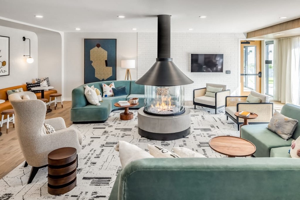 a living room filled with furniture and a fireplace