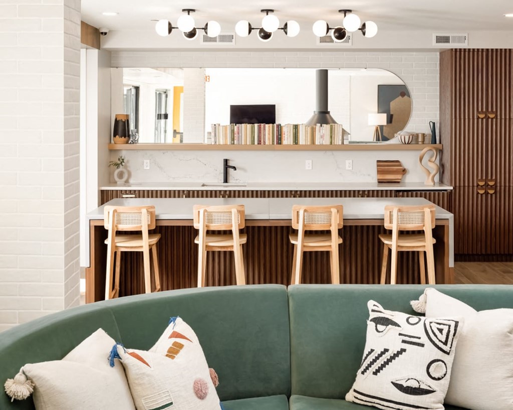 a living room filled with furniture and a large window