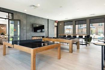 Clubhouse Game Room with ping pong, pool and fireplace views