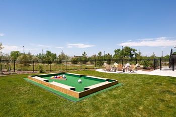 Bocce Ball Courts with patio chairs and firepit