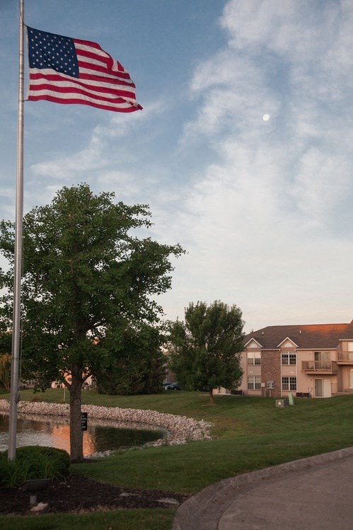 an flag flying in front of a building