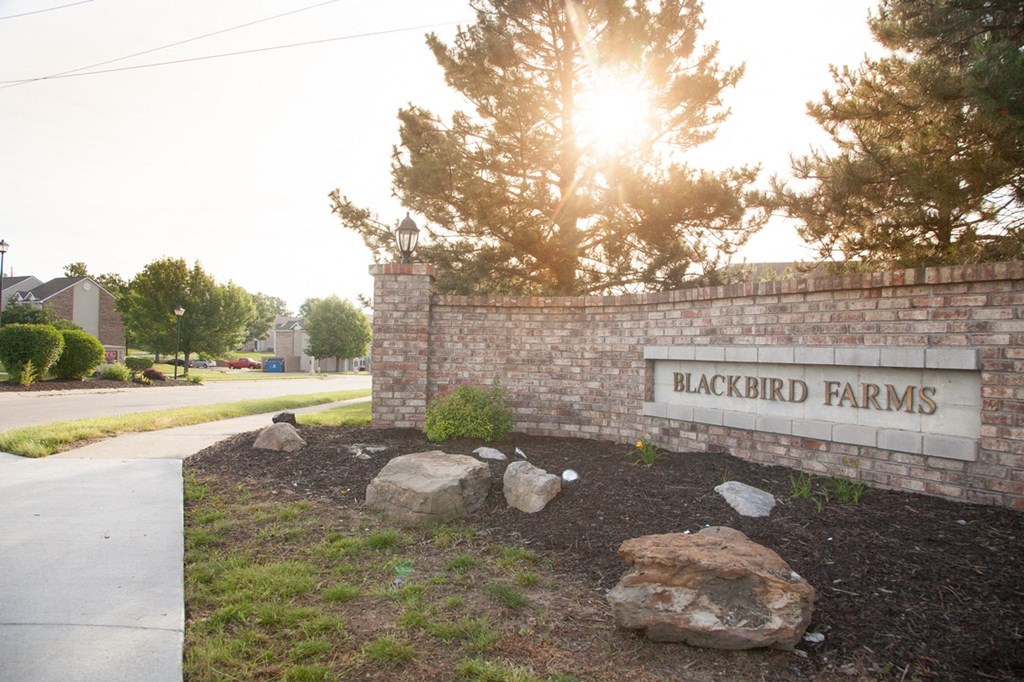the sign for blackford farms in front of a brick wall
