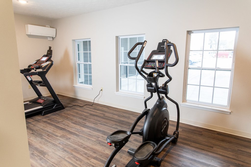 the upstairs exercise room has two treadmills and a treadmill