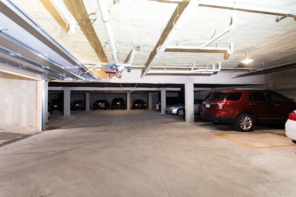 a parking garage with cars parked in it