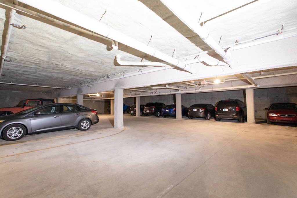 a parking garage with cars parked in it