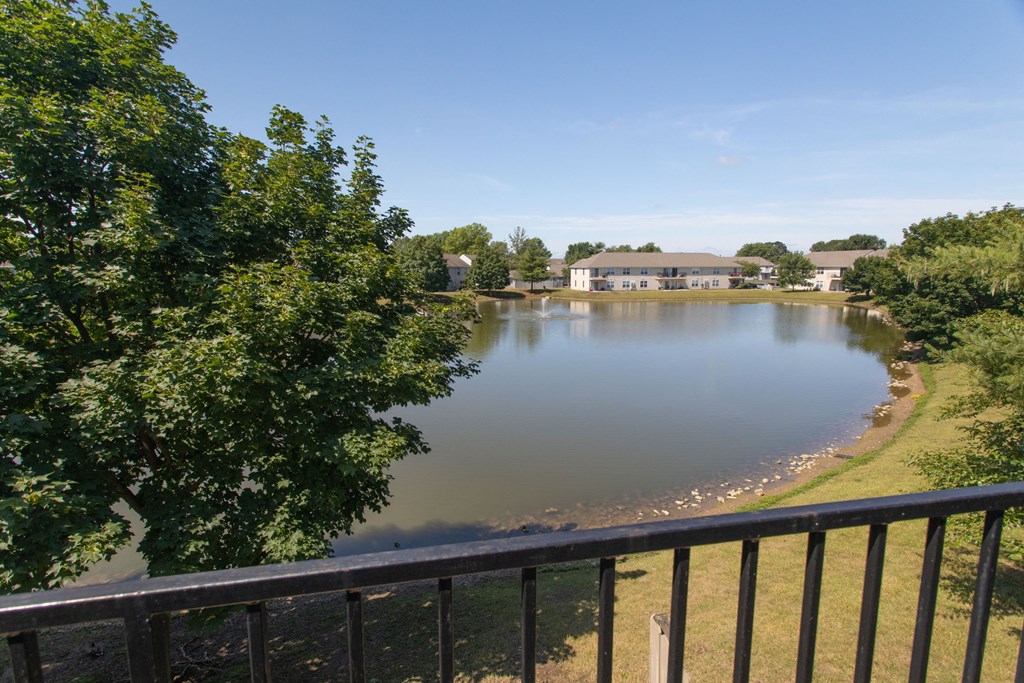 a view of a lake from a balcony