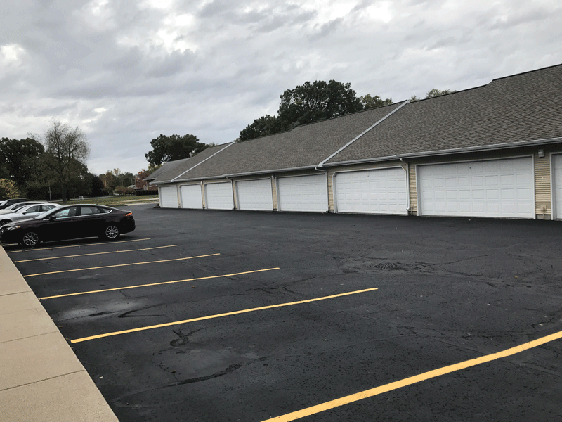a parking lot with a building in the background