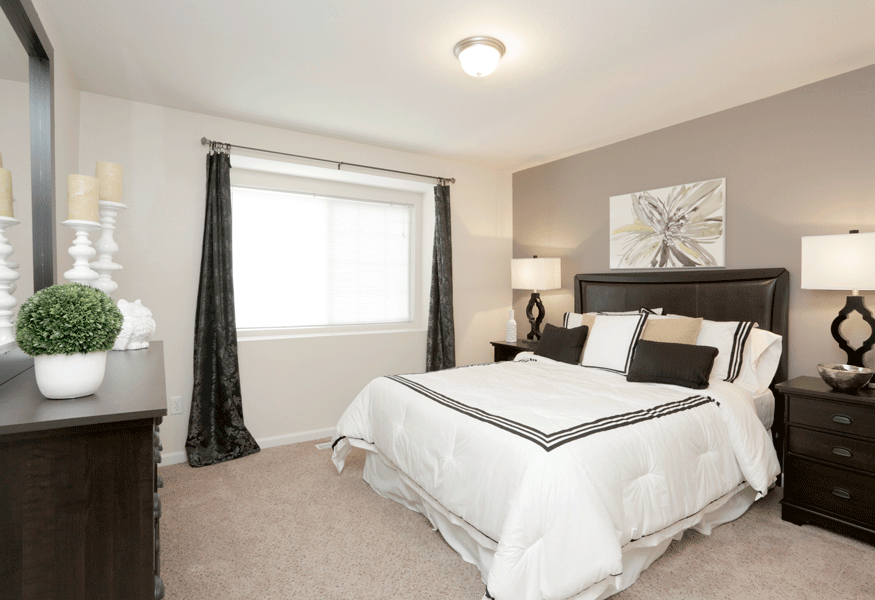 a bedroom with a bed and two night stands