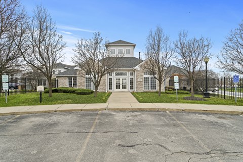 A large building with a parking lot in front of it.