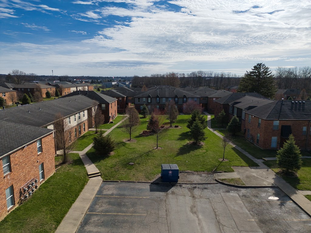 an aerial view of a neighborhood with houses and trees