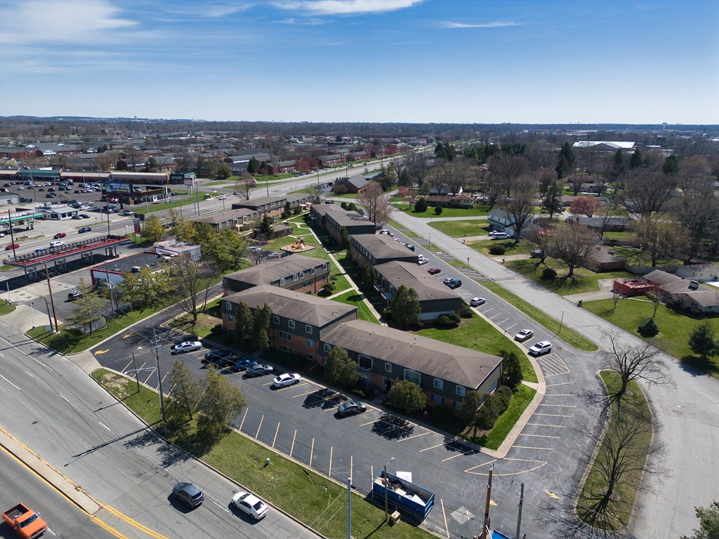 an aerial view of a neighborhood with houses and cars on the street