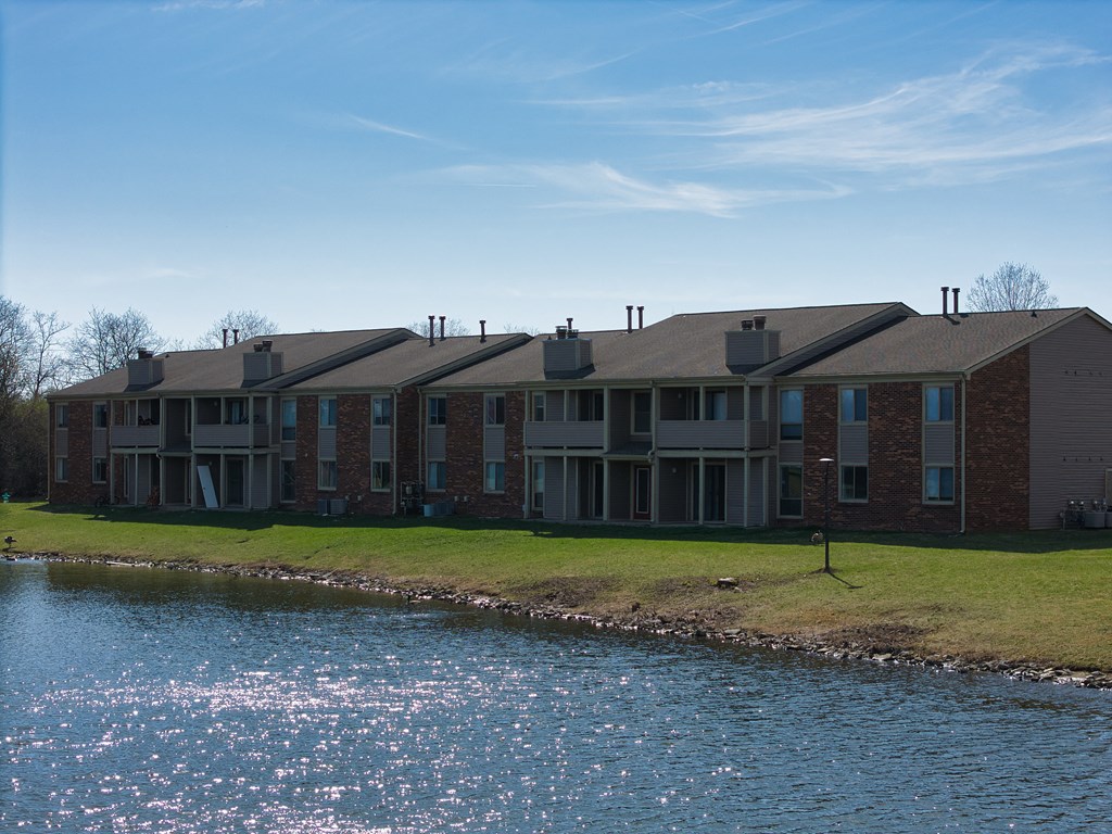an apartment building overlooking a body of water