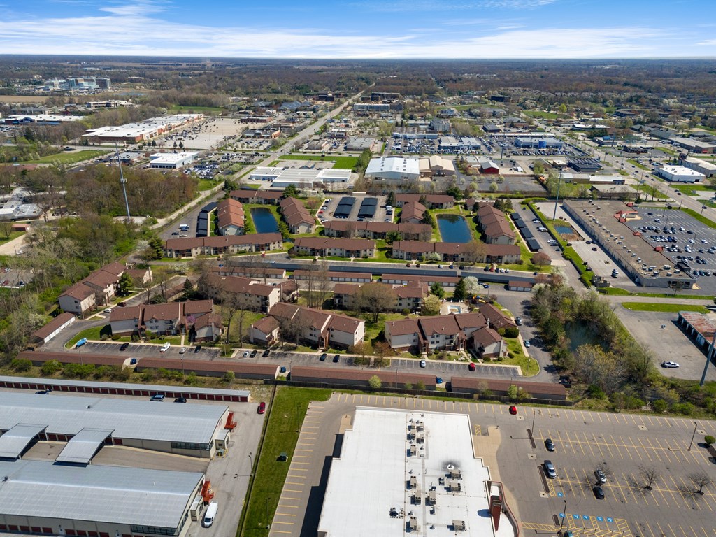 an aerial view of a city with cars parked in a parking lot at The Element @ St Andrews, Mishawaka, IN, 46545