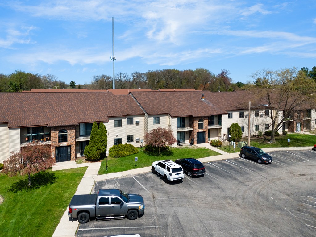 a large building with cars parked in a parking lot at The Element @ St Andrews, Mishawaka, IN