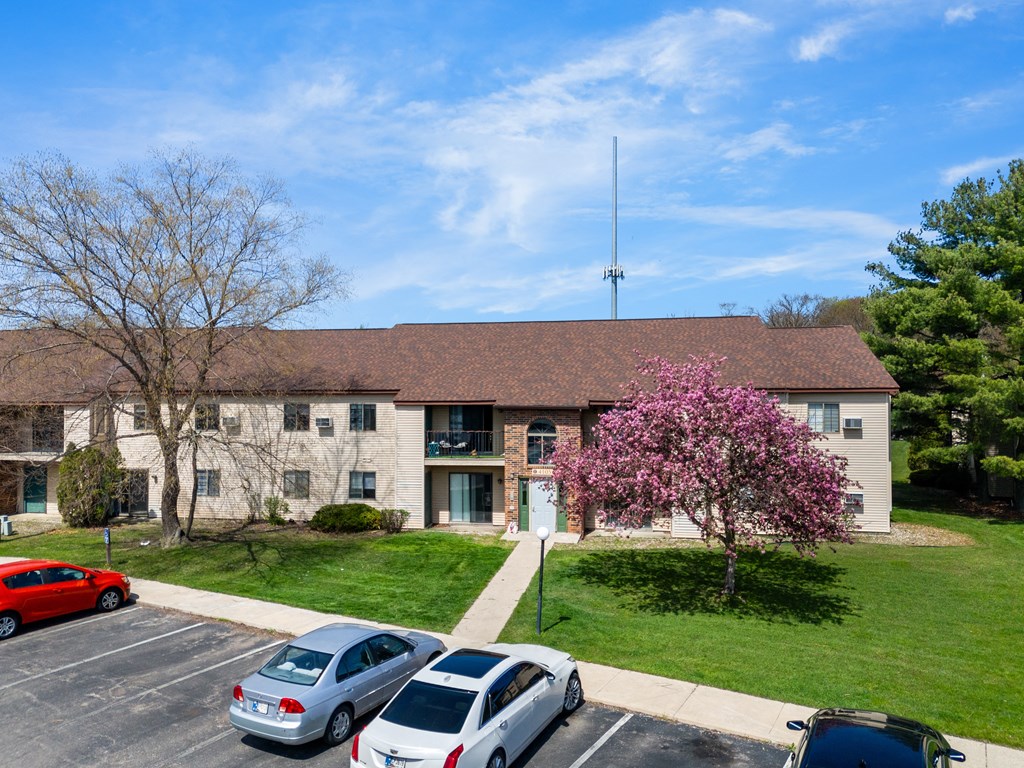 the front of a building with cars parked in a parking lot at The Element @ St Andrews, Mishawaka, Indiana