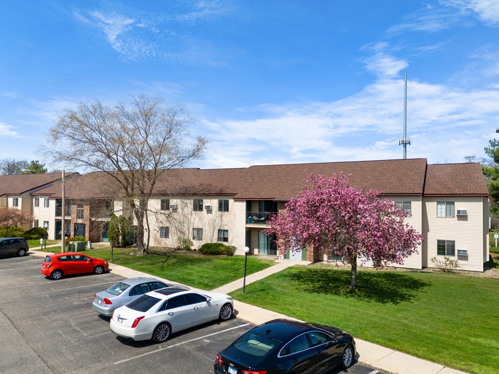 a large building with cars parked in front of it at The Element @ St Andrews, Indiana