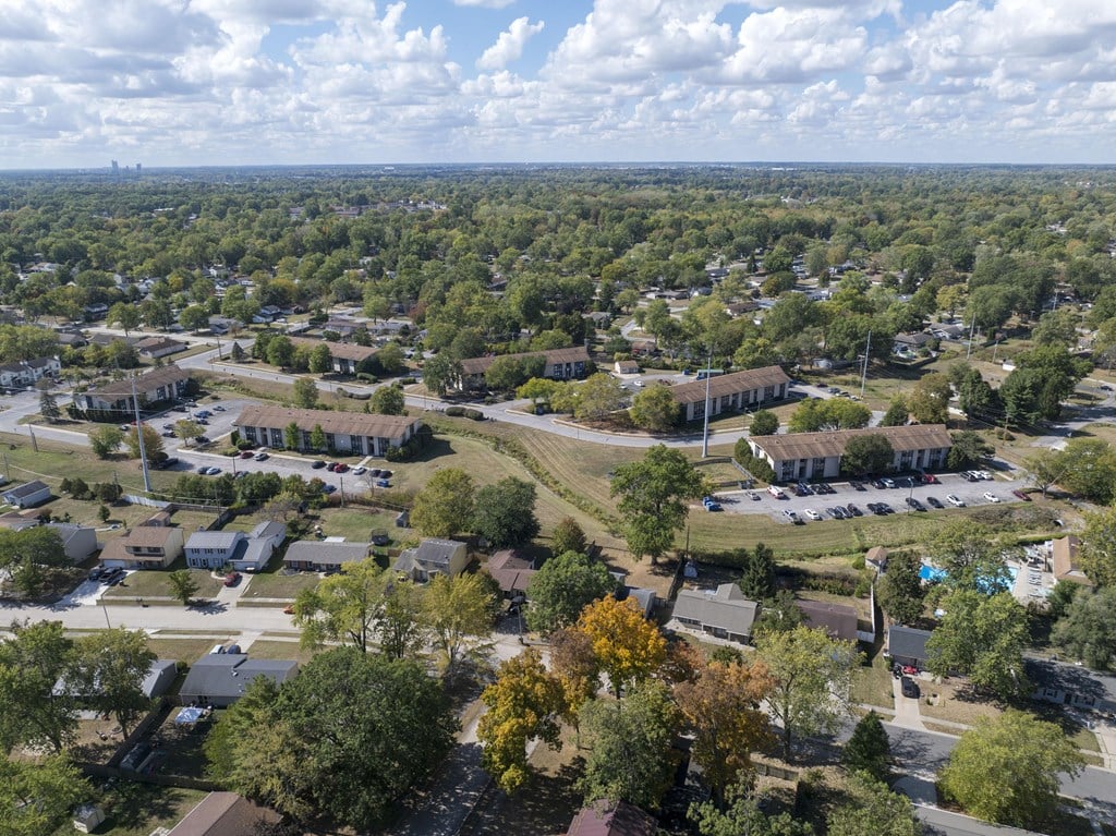 A suburban neighborhood with houses and trees.