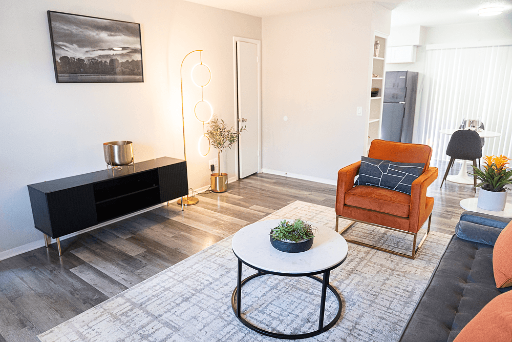 a living room with a couch and a coffee table at La Bella Apartments, Fort Worth