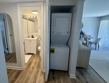 A white bathroom with a walk-in shower and a toilet.