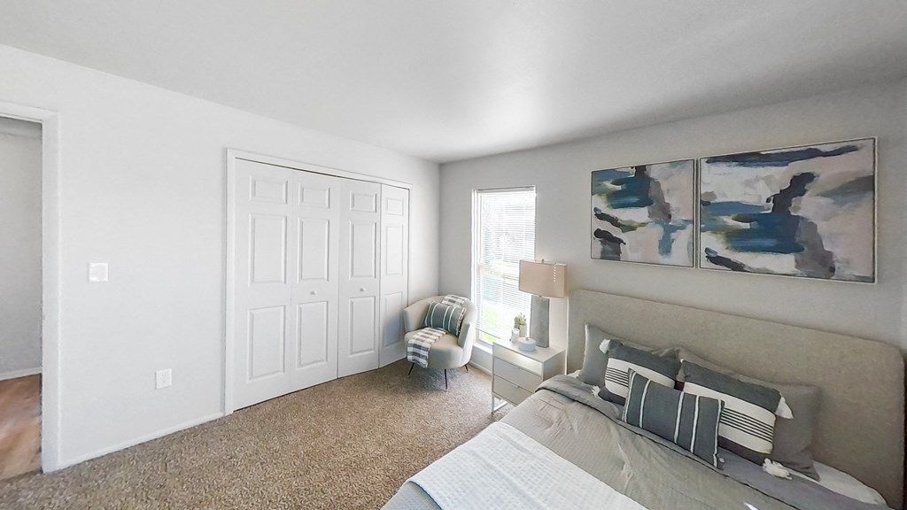 an open living room with a couch and a window