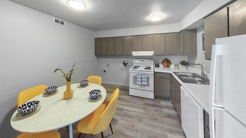 a kitchen with white appliances and a table with yellow chairs