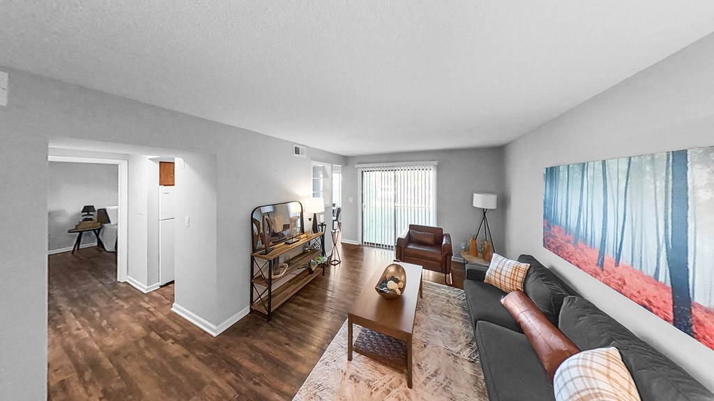 a living room with a couch and a table