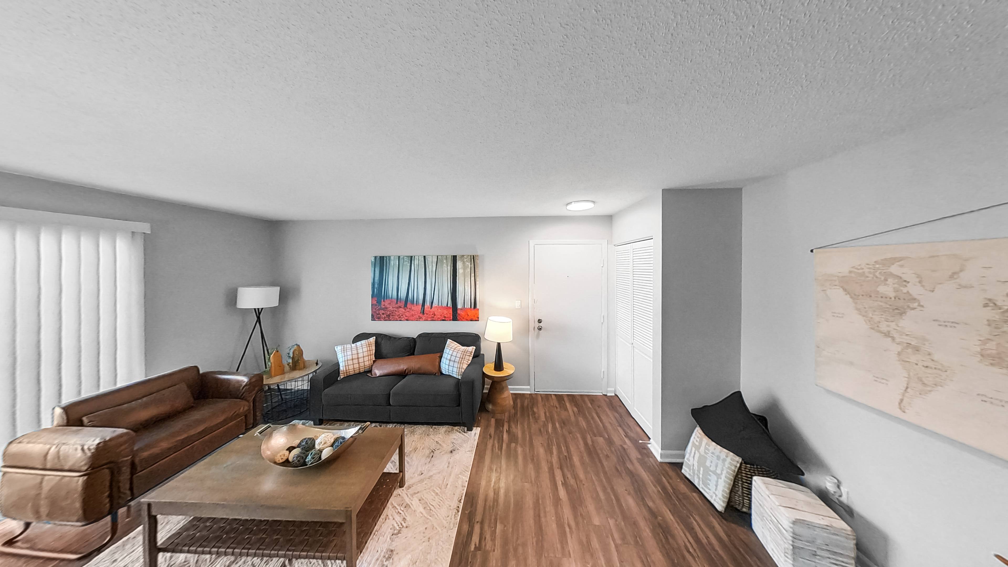 a living room with two couches and a coffee table